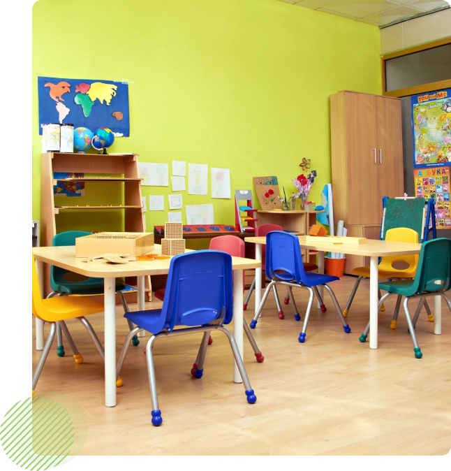 A classroom with tables and chairs in it